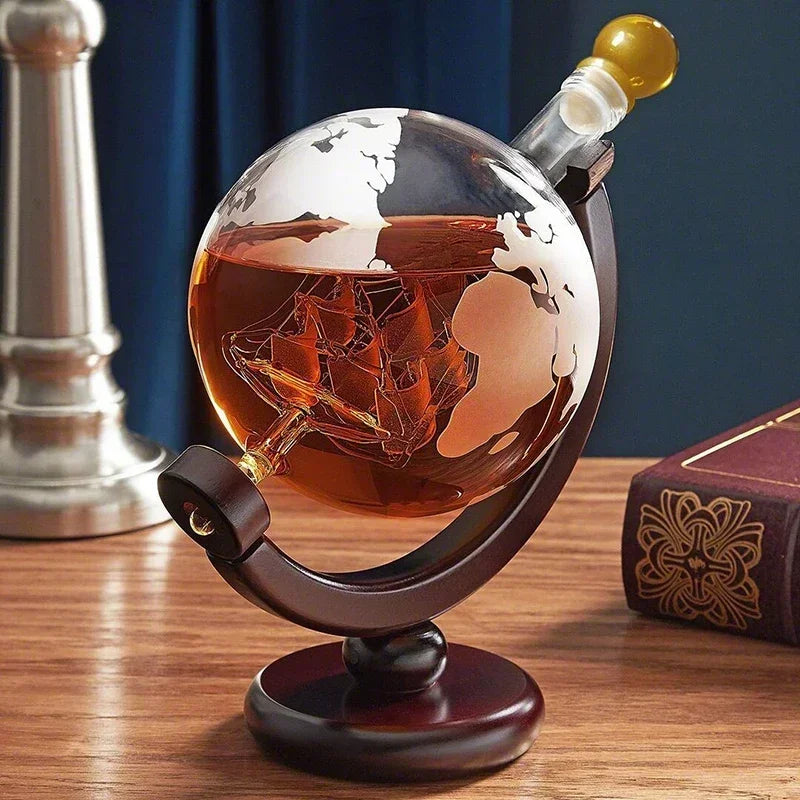 Close-up of J.Y.R® Globe Decanter – Lead-free glass carafe with an intricately detailed glass ship inside