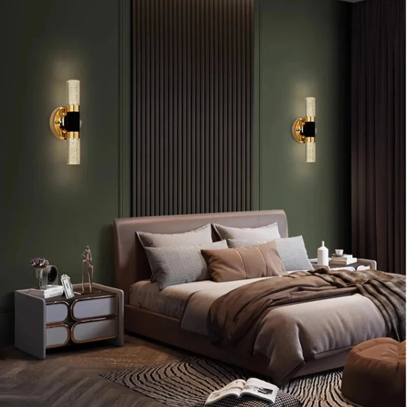 Elegant gold and black vanity wall lamp illuminating a contemporary bedroom, perfect for mirror or hallway decor.