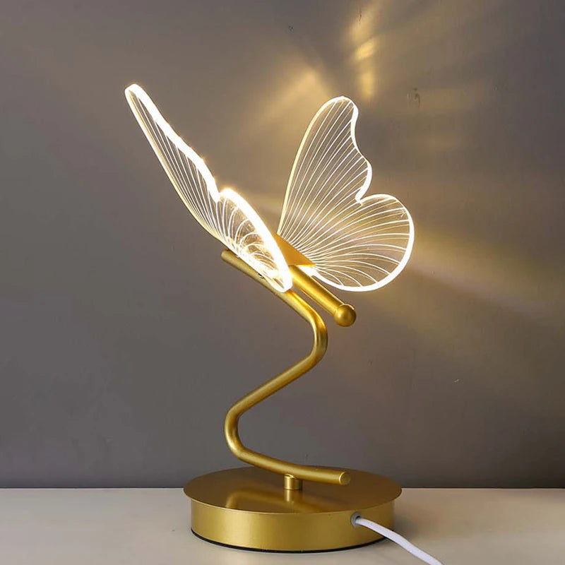 Close-up of the butterfly wings glowing softly in the J.Y.R® Graceful Glow Lamp.